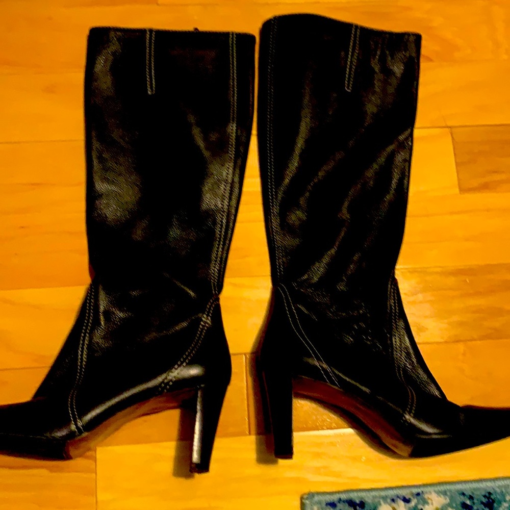 Almost new heeled boots( about 3.5 inch heel) black all leather upper , wider